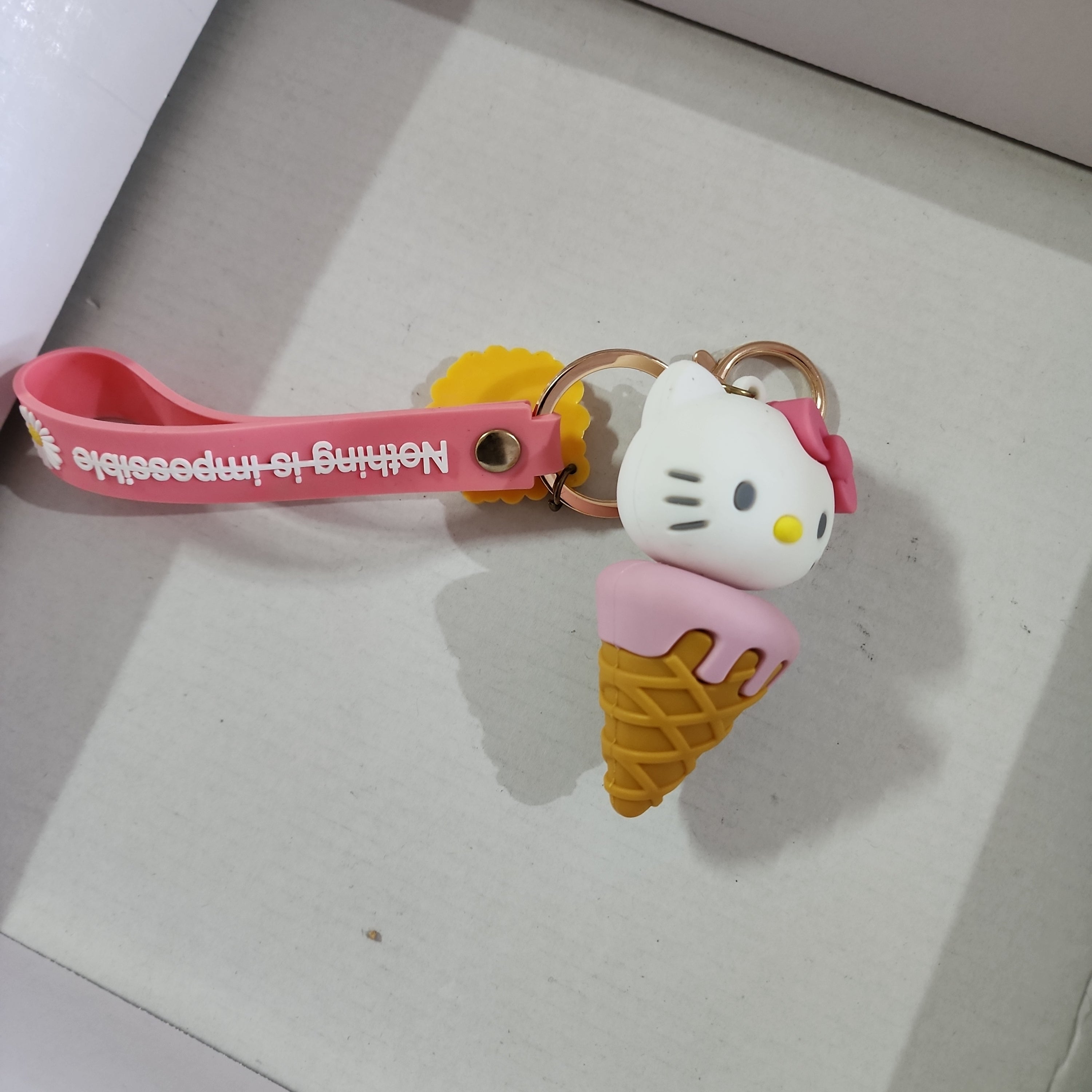 Hello kitty on ice cream cone , keyholdee keychain